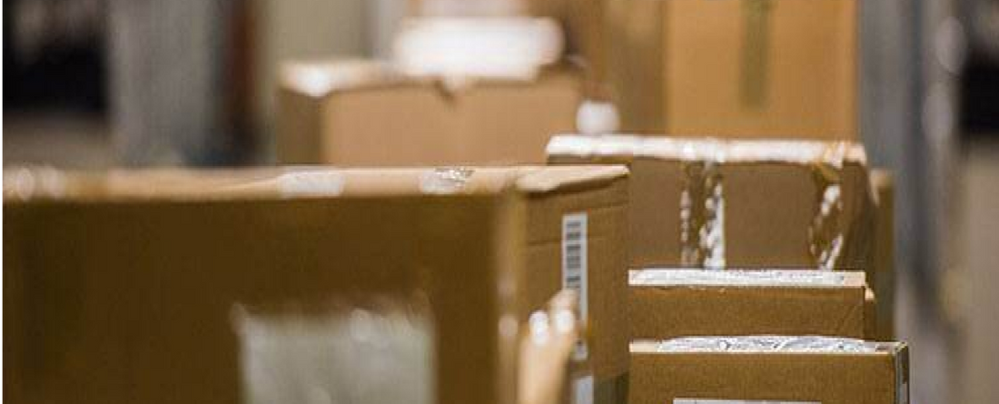 A row of shipping boxes in a warehouse setting
