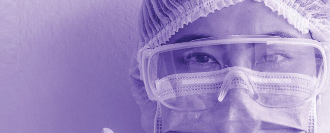 Close-up of a healthcare worker wearing protective gear, symbolizing frontline workers during COVID-19.