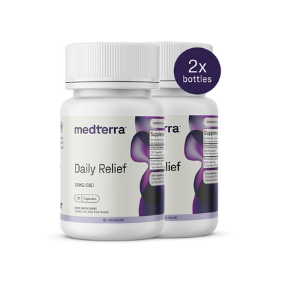 Two bottles of Medterra's Daily Relief CBD Isolate Capsules, featuring 25mg per serving. The white label with purple and black accents emphasizes "THC-free" and "on-the-go relief," with a circular badge noting "2x bottles.