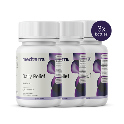 Three bottles of Medterra Daily Relief CBD Isolate Capsules, with white caps and predominantly white labels accented in purple and black, are aligned side by side for THC-free relief. A purple circle on the right indicates "3x bottles.