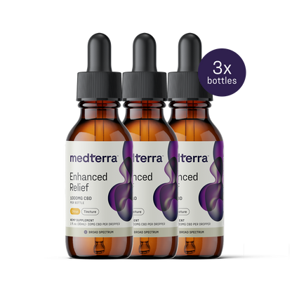 Three bottles of Medterra Enhanced Relief Broad Spectrum CBD Oil, each with 1000mg, are lined up. The white label with a purple abstract design notes "3x bottles," highlighting its role in promoting overall wellbeing.