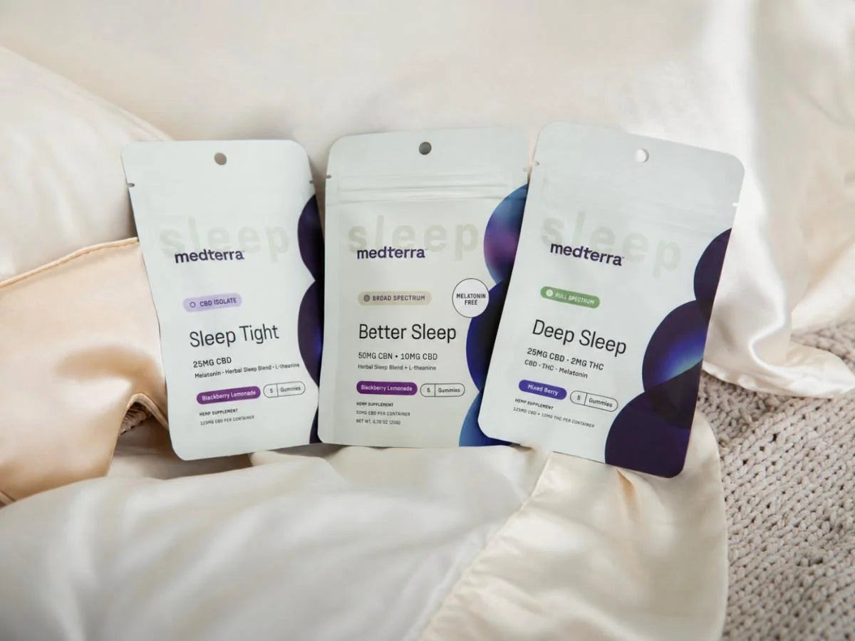 Sleep Tight, Better Sleep and Deep Sleep pouches laid out on cream bedding